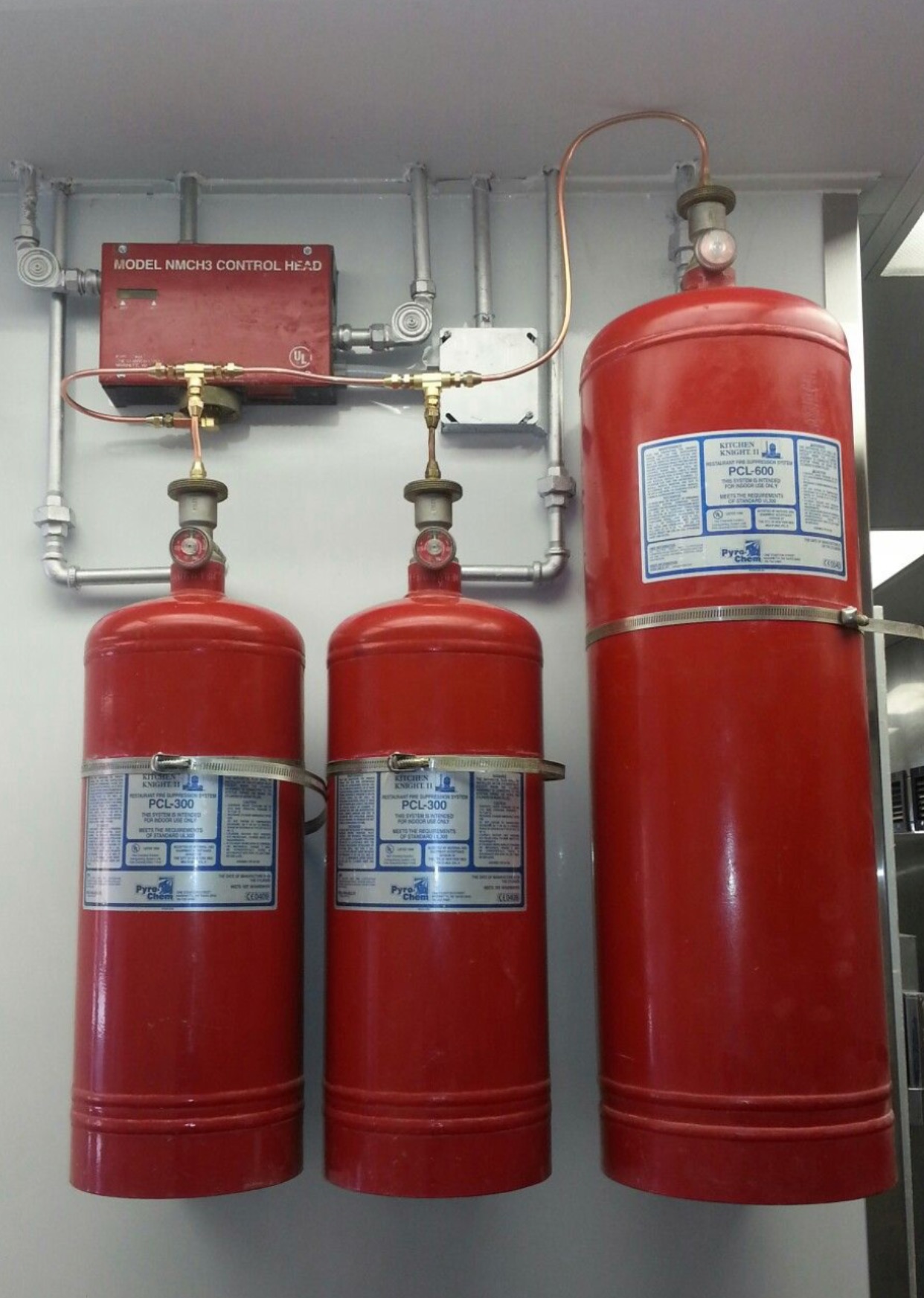 Pyro-Chem fire suppression system installed in a commercial kitchen